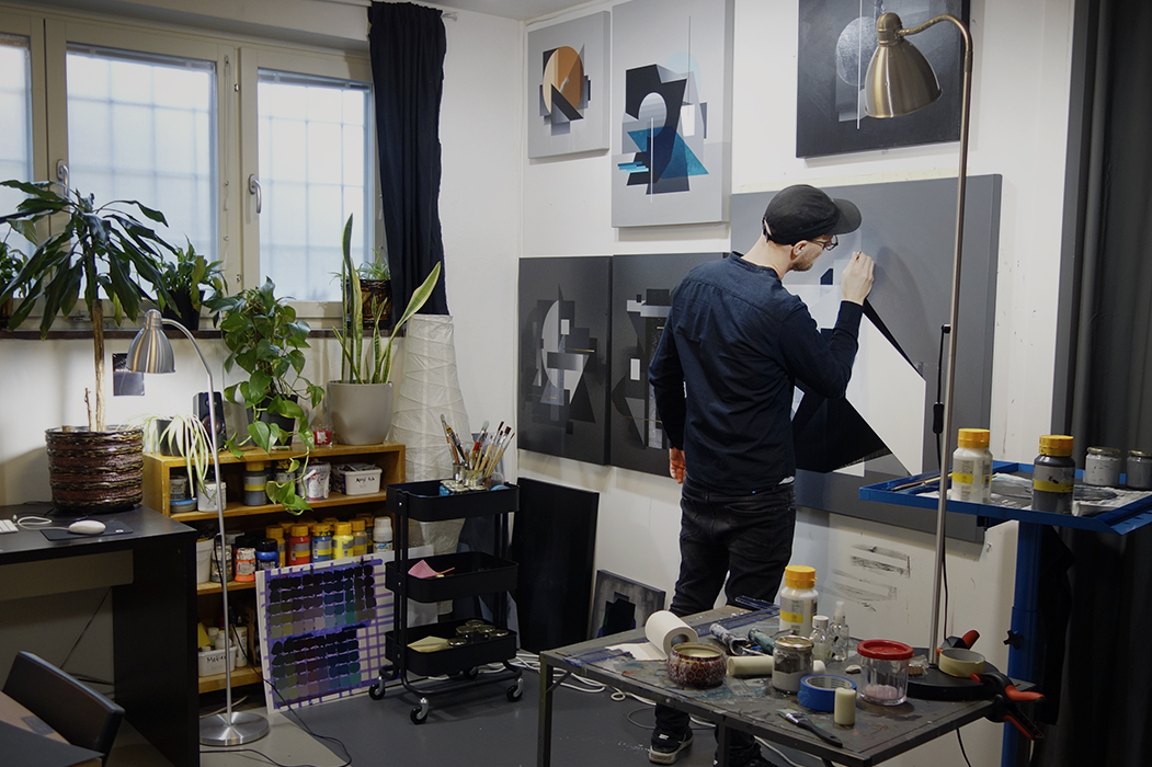 Artist Gustav Norberg painting in his studio
